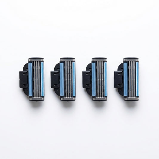 Four razor heads with blue cartridges on a white background